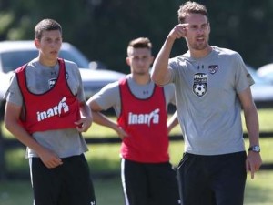 Head coach Cheyne Roberts, right, talks with his players during a drill in practice with the Ocala Stampede at the Ocala Regional Sportsplex in Ocala, Fla. on Friday, May 16, 2014. Star-Banner Photo/Bruce Ackerman 